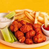 Crispy Buffalo Cauliflower Basket · Our veggie spin on Buffalo wings, served with vegan ranch, ketchup and fries