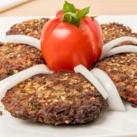 Chapli-Kabab · 4 pieces of Chapli Kabab, ground beef mixed with chopped vegetables and seasoned with crushe...