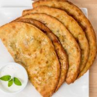 Bolani (1) · Oven baked or pan-fried flat dough filled with either a leek or potato stuffing. Comes with ...