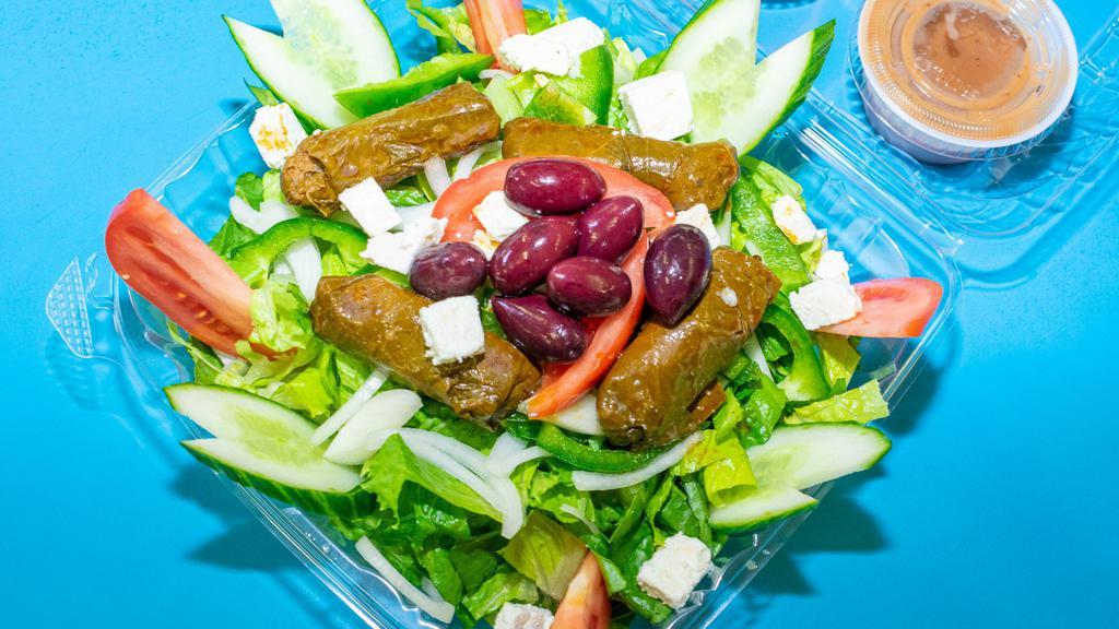 Greek Salad · Tomatoes, cucumbers, onions, olives, and feta cheese. Greek dressing.