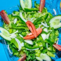 House Salad · A mixture of fresh seasonal greens.
