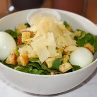 Caesar Salad · Romaine,  house-made croutons, shaved Parmesan, and caesar dressing.

Add chicken or vegan c...