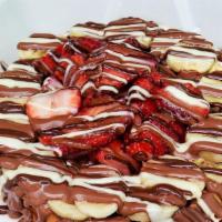 Fruity Waffle · Your choice of two fruits topped with triple chocolate drizzle.