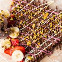 Strawbana Crepe · Sweet Crepe Stuffed with Strawberry Banana chocolate  and topped with more chocolate served ...