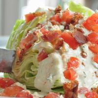 Wedge Salad · Gorgonzola, bacon, tomatoes, creamy Parmesan dressing.
