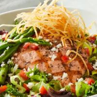 Grilled Salmon Salad · Norwegian salmon, field greens, tomatoes, grilled asparagus, feta, crispy shoestring potatoe...