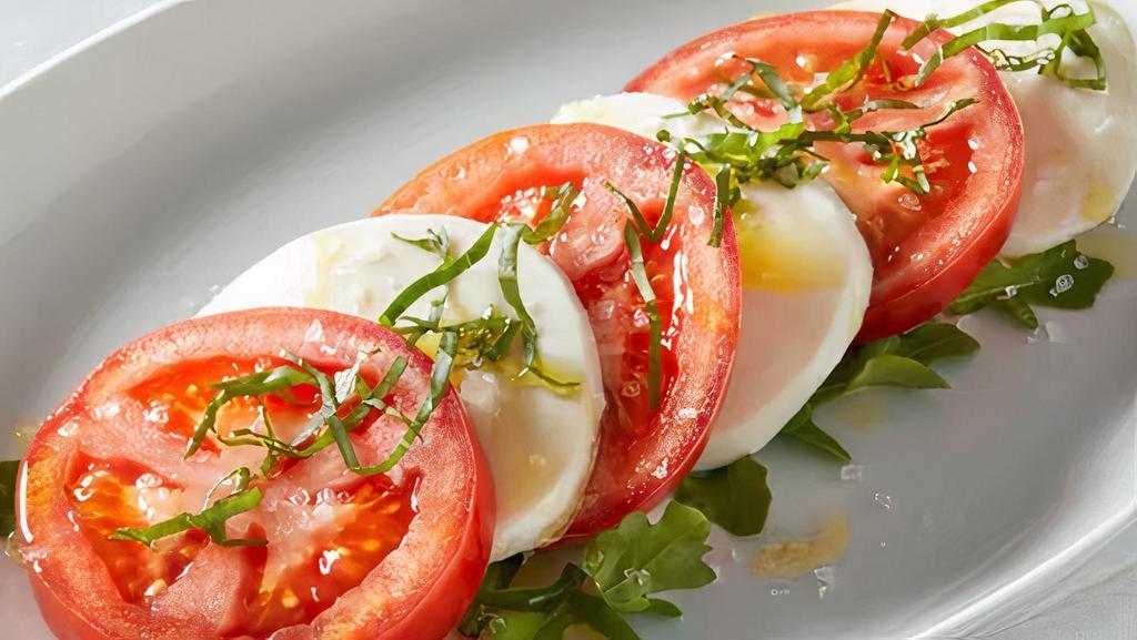 Tomato Caprese Salad · Regular. Vine-ripened tomatoes, arugula, fresh mozzarella, basil, balsamic drizzle.