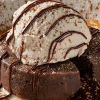 Warm Chocolate Cake · Molten chocolate cake, anglaise and vanilla gelato.