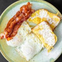 French Toast Combo · One slice French toast, two eggs and choice of ham, sausage or bacon.