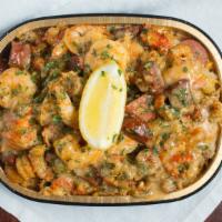 Seafood Deluxe · Potato, Shrimp, Crawfish and Andouille Sausage, garlic butter, 3 types of cheese, parsley