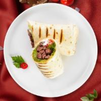 Philly Cheese Steak Cure Wrap · Steak, melted American cheese, grilled onions, and peppers on a wrap. Served with french fri...