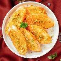 Carry On Garlic Bread · Housemade bread toasted and garnished with butter, garlic, and parsley.