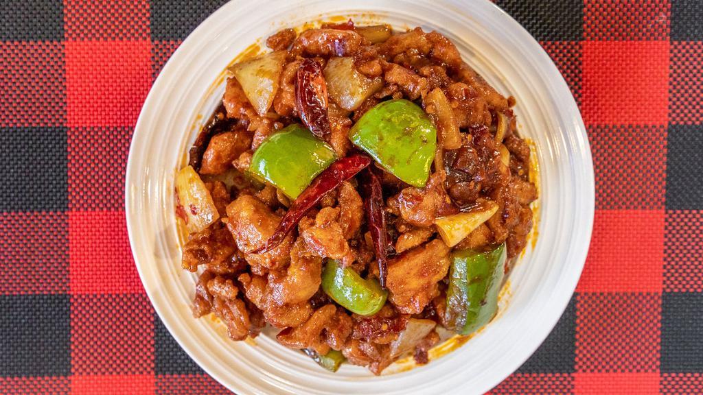 Spicy Diced Chicken · Lightly fried chicken with onion and green pepper cooking in chef special sauce, hot and spicy.served with white rice.