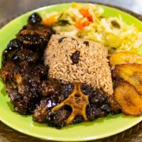 Oxtail · Succulent oxtails seasoned and slow cooked till tender covered in a hearty beef and onion gr...