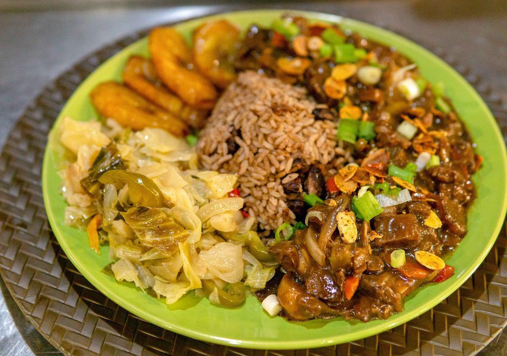 Jerk Jackfruit (Vegan) · Chunks of jackfruit marinated in jerk sauce simmered with potatos, sweet peppers, Caribbean style soy chunks, chickpea, carrots, Cabbage and onions.
