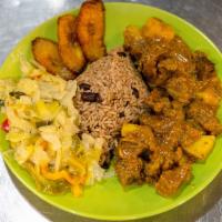 Curry Goat · Tender chunks of goat cooked in a simmering stew of Jamaican curry, potatos, onions and seas...