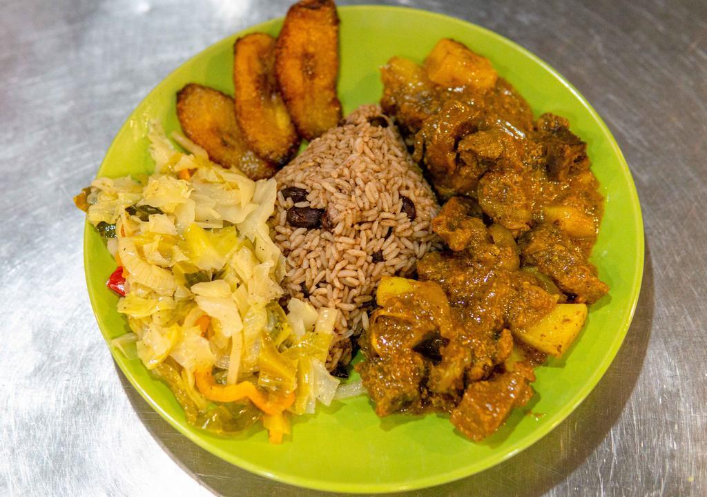 Curry Goat · Tender chunks of goat cooked in a simmering stew of Jamaican curry, potatos, onions and seasonings.