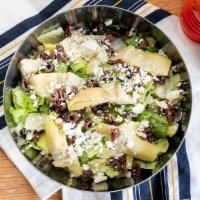 Side Greek Salad · Mixed lettuce topped with black olives, artichoke, and feta cheese. Try adding grilled chick...