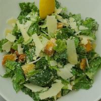 Caesar Salad · Romaine hearts tossed with croutons, parmesan cheese & lemon caesar dressing.