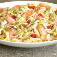 Seafood Fettuccine Alfredo · Sautéed shrimp, crab meat and tomatoes, in our Old Bay spiced Alfredo sauce, served over fet...