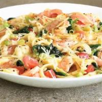 Shrimp Fettuccine Alfredo · Sautéed shrimp, spinach and diced tomatoes, in our old bay™ spiced Alfredo sauce, served ove...