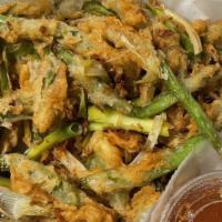 Crispy String Beans · mild spicy. breaded green beans sautéed with bell pepper, onion, scallion, sweet 'n' sour dip.