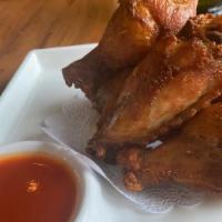 Chicken Wings · house marinated deep-fried wings. sriracha dip.