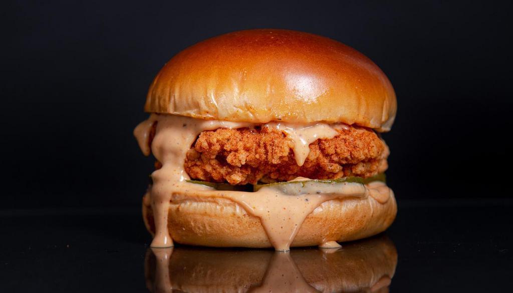 The Classic Sandwich · Cornflake Crusted Chicken Breast seasoned in our signature spice blend in between a toasted brioche bun with pickles, and classic sauce.