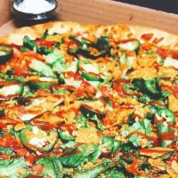 Taco Pizza · Seasoned beef, taco sauce, lettuce, tomato, black olives, onions and jalapeños topped with c...