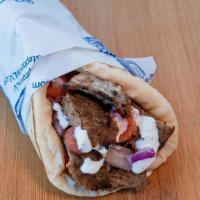 Beef & Lamb Gyro Wrap · Our most popular wrap. Sliced gyro wrapped in pita bread with tomatoes, onions, and tzatziki...