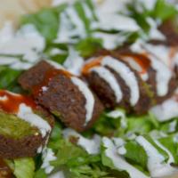 Falafel Gyro · Vegetarian. fried veggie balls. Served with lettuce, tomatoes, onions, cucumbers, and our si...