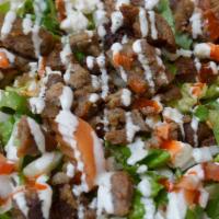 Beef Salad · Lean meat sliced and grilled. Served with lettuce, tomatoes, onions, cucumbers, pickled vegg...