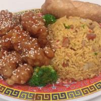 Sesame Chicken · Served with egg roll and choice of rice.