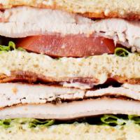 Club Sandwich · Ham, Turkey, bacon, lettuce, tomatoes, mayo.
