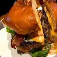 Bacon Cheese Burger · 1/2 LB Patty,Bacon,Lettuce,Tomatoes,Onions, Cheese,Served on a Toasted Bun with Mayonnaise &...