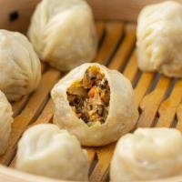 Steamed Vegan 蒸素饺 - 8Pcs · Packed with Shiitake mushrooms, flavored bean curd, fresh cabbage, red carrots, glass noodle...