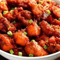 Chicken 65 · Spicy boneless deep-fried chicken cooked in aromatic Indian spices.