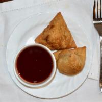 Vegetable Samosa · Delicious pastries stuffed with well-seasoned potatoes, peas and herbs. Served with special ...