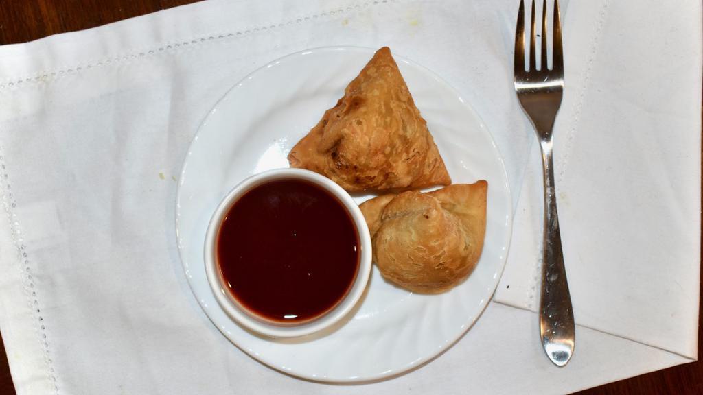 Vegetable Samosa · Delicious pastries stuffed with well-seasoned potatoes, peas and herbs. Served with special homemade sauces.