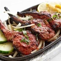  Lamb Chops · Lamb chops marinated overnight in a variety of herbs and spices.