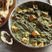 Saag Paneer · Finely cut garden fresh spinach cooked with homemade cheese in delicate Indian spices and he...