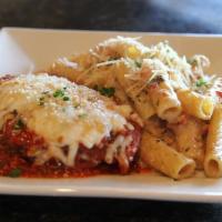 Chicken Parmesan · Baked in our pear tomato sauce with Mozzarella and Parmesan