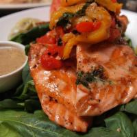 Wood Grilled Salmon · Wood grilled with Roasted Garlic Butter