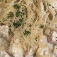 Fettuccine Alfredo · Tossed with mushrooms, Parmesan and Romano in our garlic cream sauce