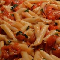 Penne Pomodori · Tossed with fresh basil, roasted garlic butter, Romano and tomatoes