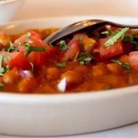 Chana Masala · Chick peas steamed with fresh tomatoes, onions, ginger, garlic and freshly ground spices.