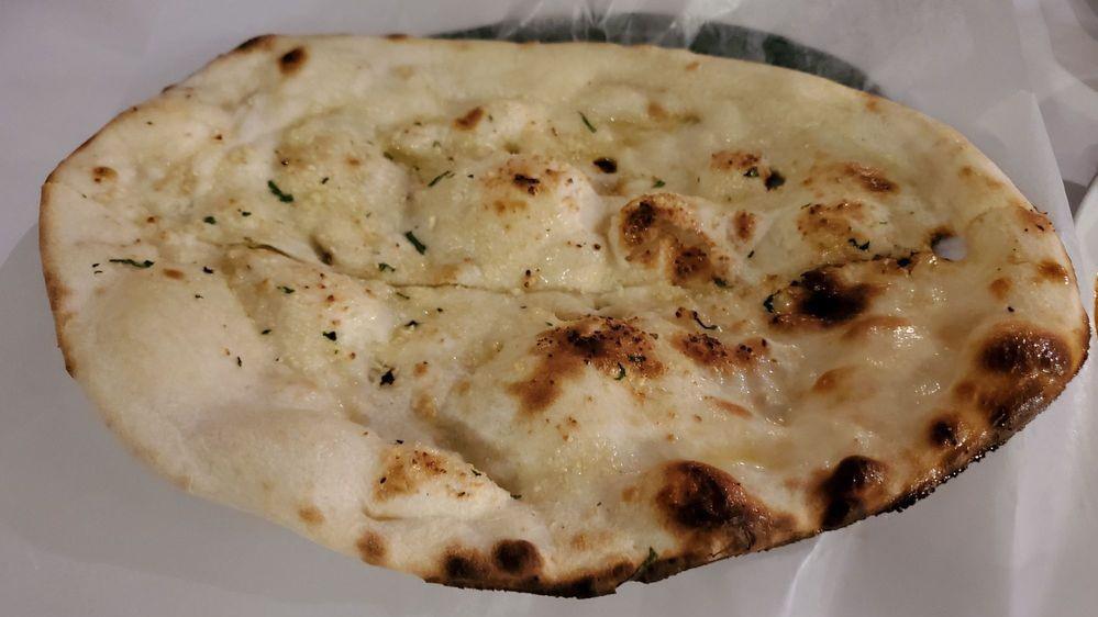 Garlic Naan · White unleavened bread with a garlic touch.