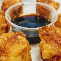 Fried Shrimp Shumai · Six pieces of fried shrimp shumai and served with our soy garlic sauce.