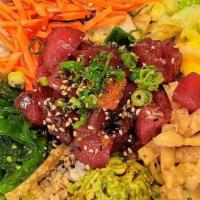 Poke Tuna Bowl · Two scoops of poke tuna, seaweed salad, seasonal fruit, poke sauce. Served with rice, lettuc...