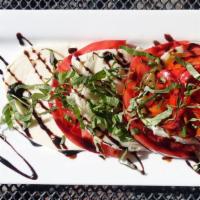 Caprese · Homemade mozzarella sitting atop thickly
sliced beefsteak tomatoes with roasted red peppers
...
